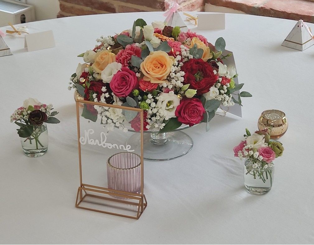 Centre de table mariage en dégradé de rose par fleuriste Toulouse