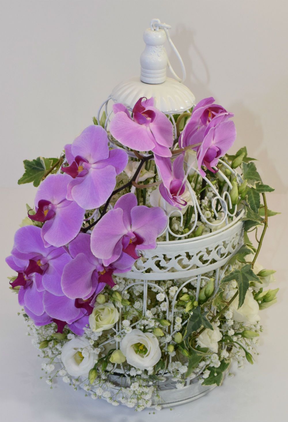 Décoration de table pour mariage en cage oiseaux fleuri avec orchidées